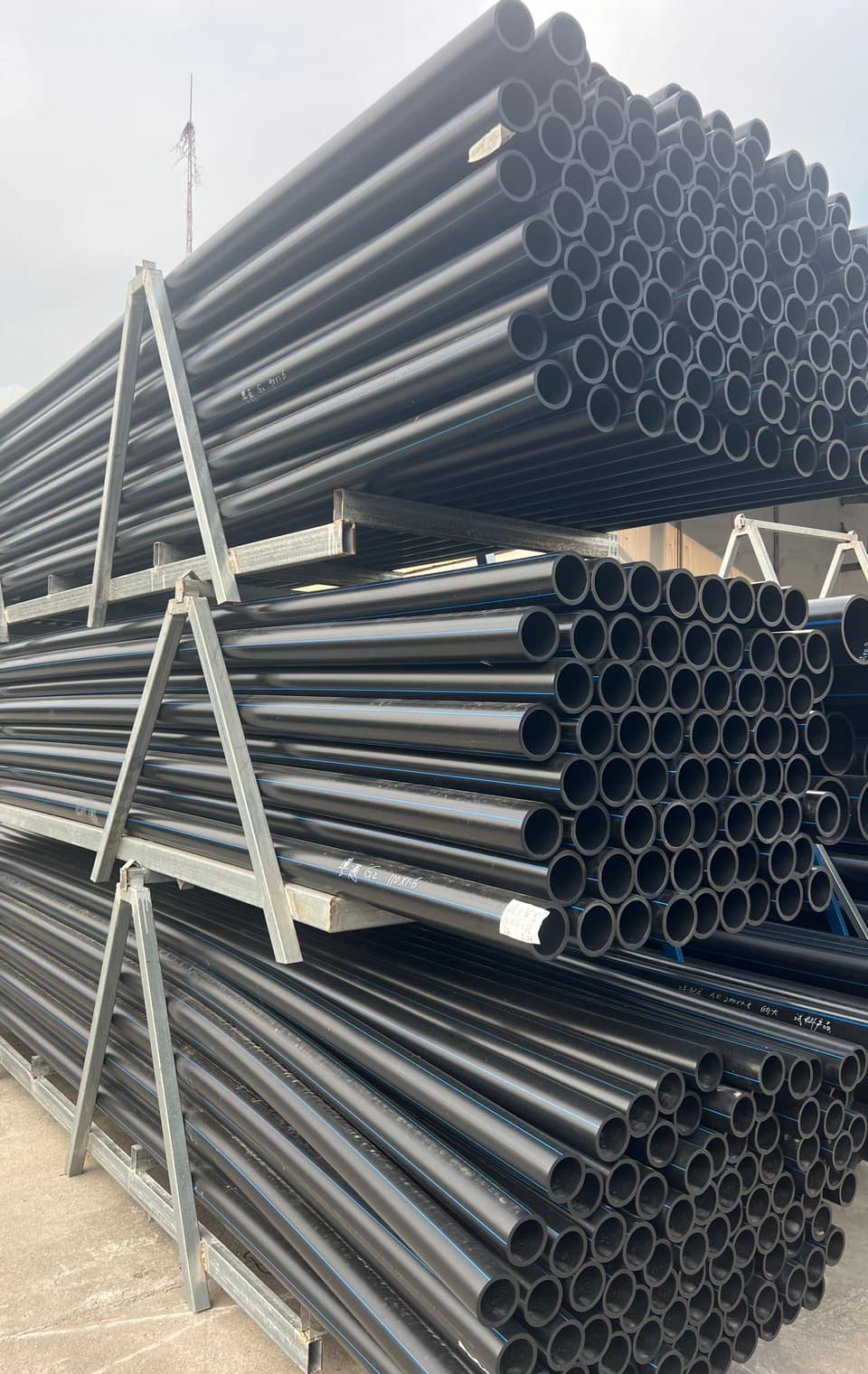 Corrugated pipe stacked in the yard, the perforated and solid sizes used for leachate collection