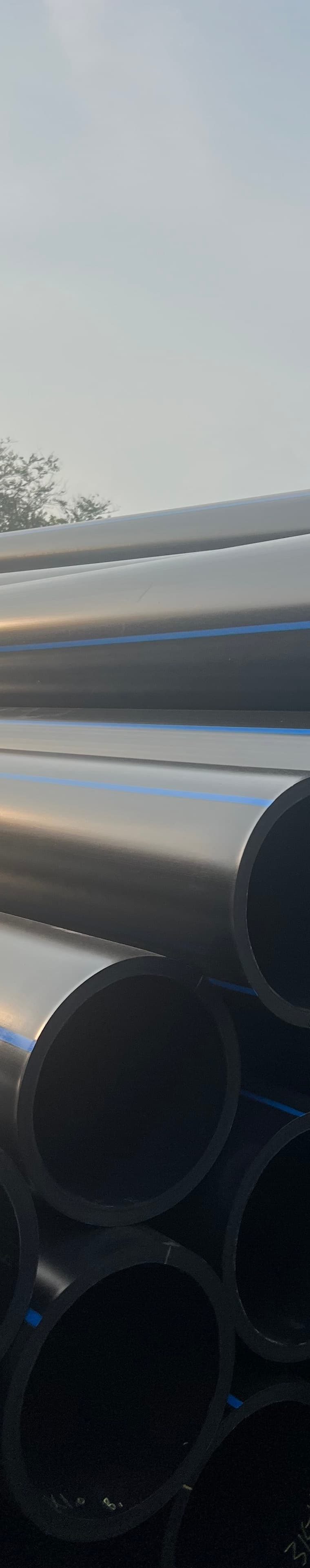 Large-diameter pipe held in stock for sleeving failing culverts