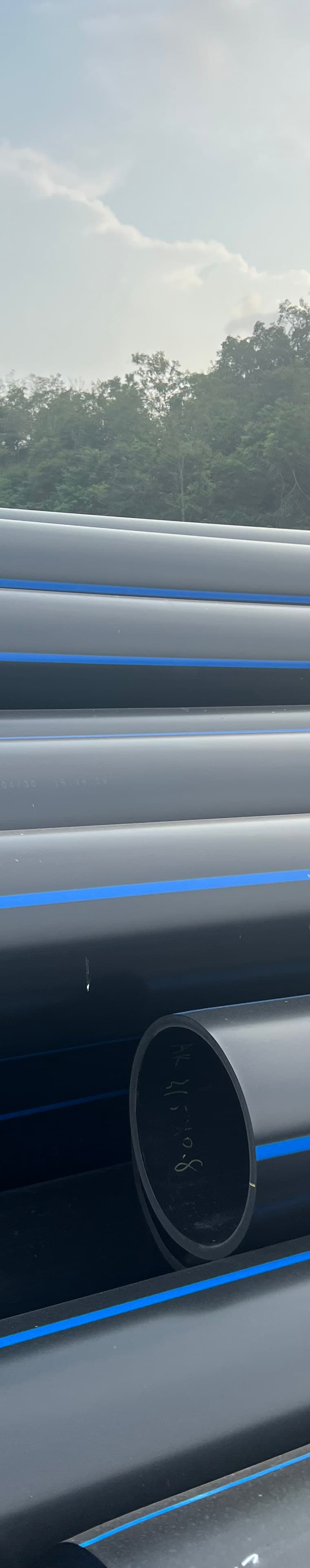 PE pipe bundled outdoors in the sizes farms order for field mains