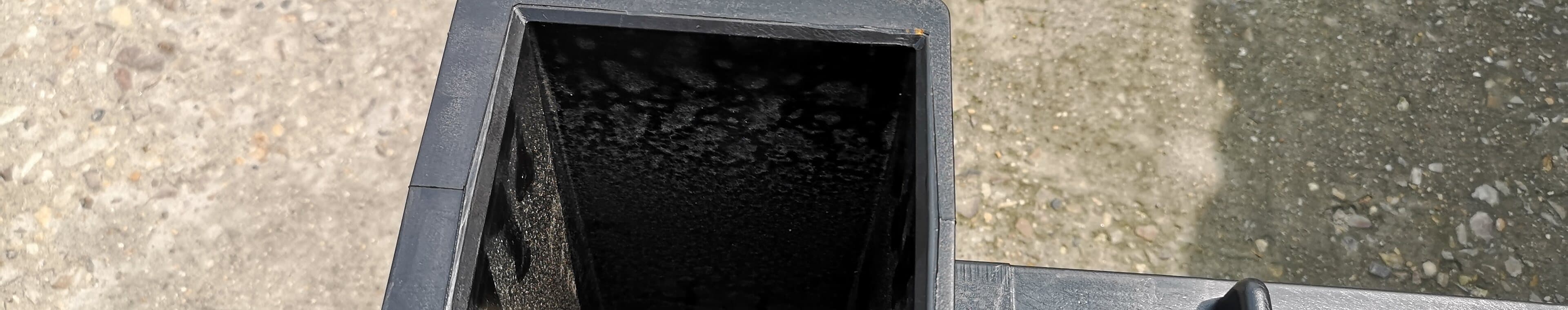 A fabricated HDPE chamber body standing outside the fabrication shop
