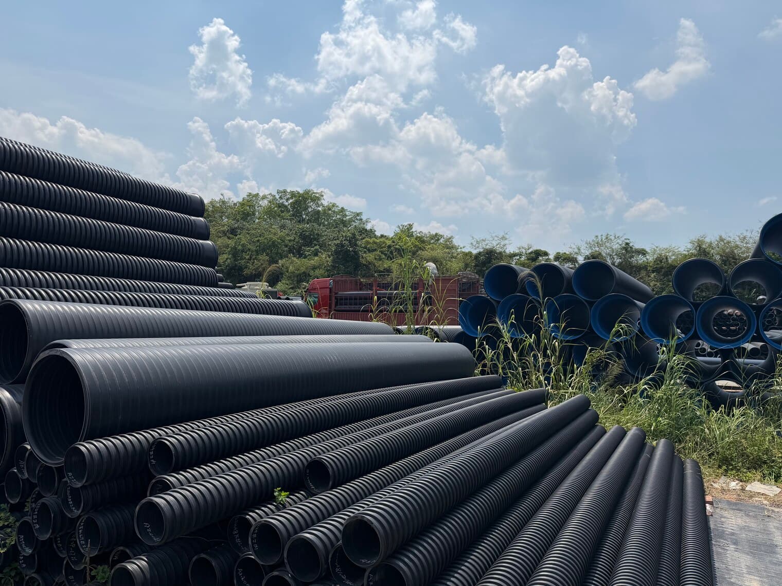 Large-diameter corrugated pipe running the depth of the yard
