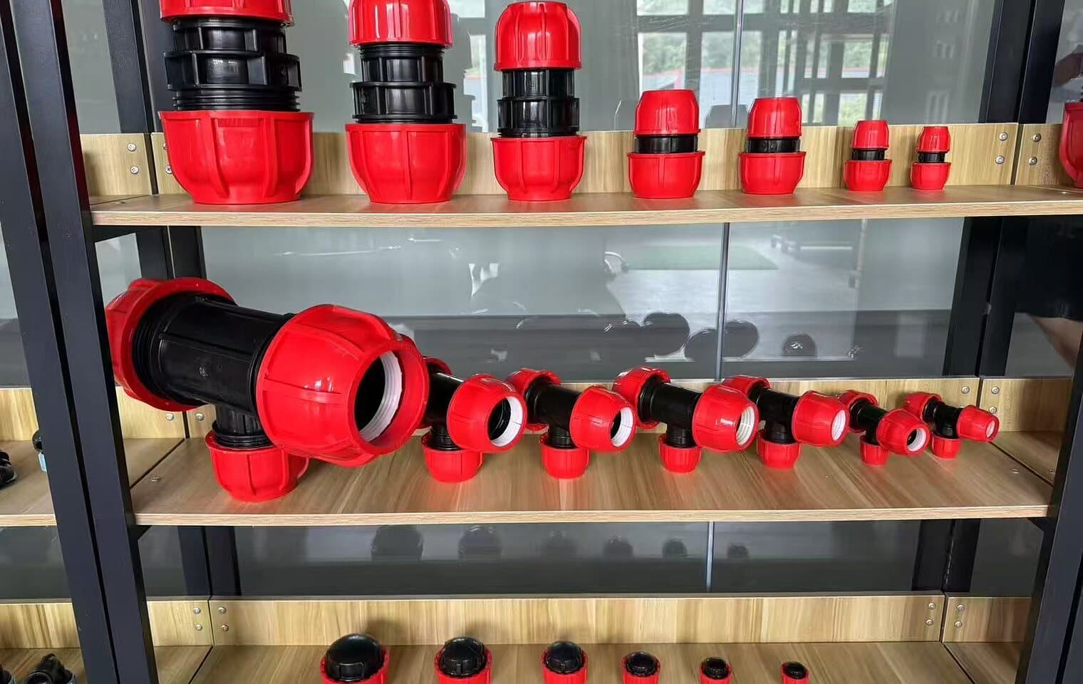 Compression fittings arranged on the showroom shelves by size and pattern