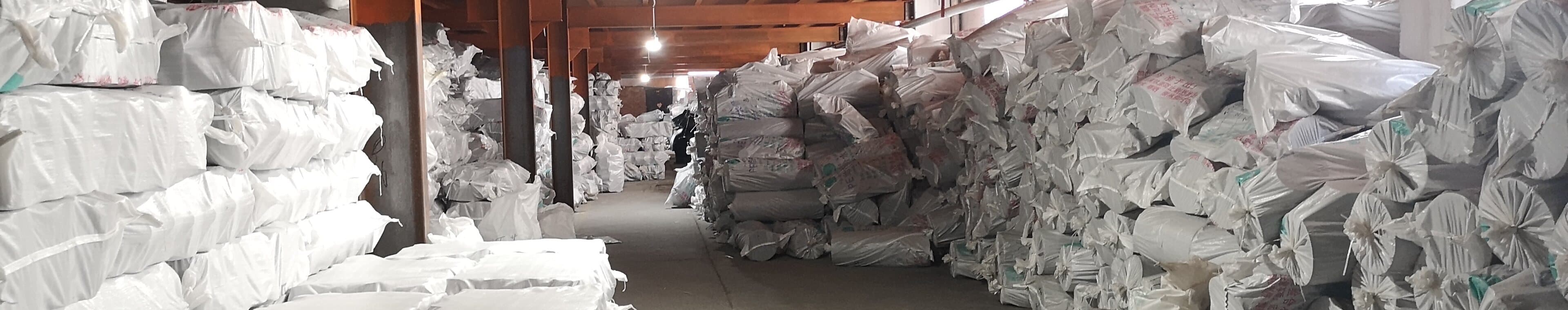 Bagged virgin PE resin held in the material store, each lot recorded on intake