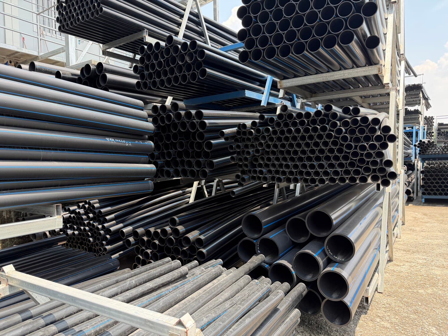 A bundle of PE100 pipe seen end-on, showing wall thickness and a clean bore