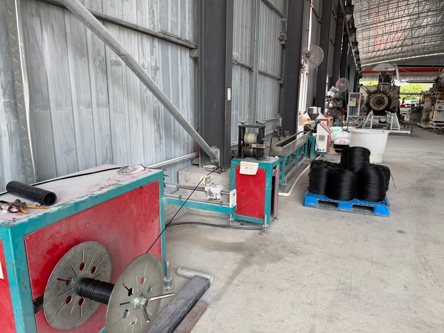 The coiling station where small-diameter pipe is wound and strapped into coils