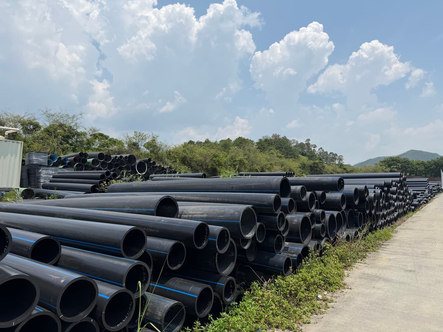 Rows of black PE100 pipe running the length of the yard