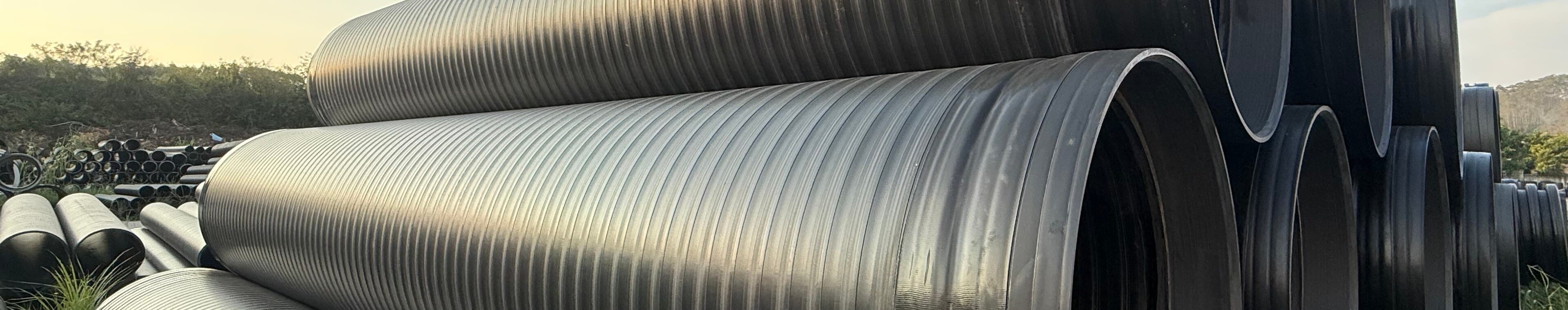 Finished pipe running the length of the stock yard, ready to draw against a project