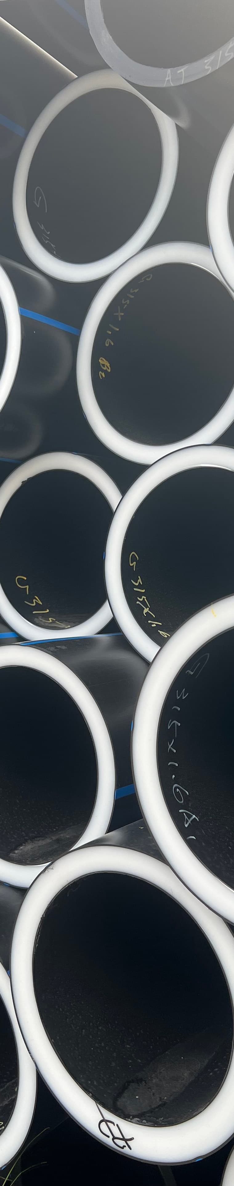 Corrugated pipe stacked outdoors, the sizes used to collect leachate
