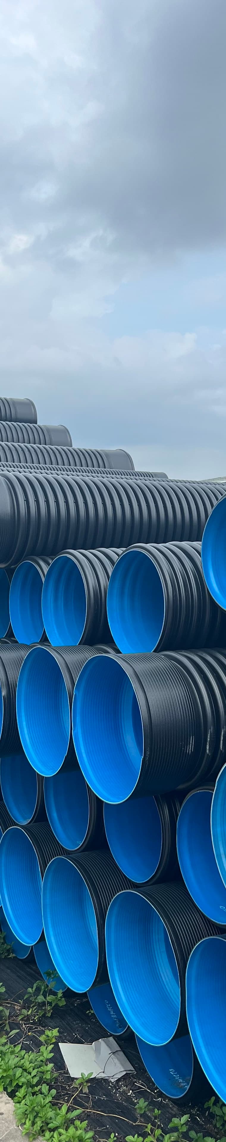 Conduit stacked in the yard, the duct that carries cable across a solar or wind site