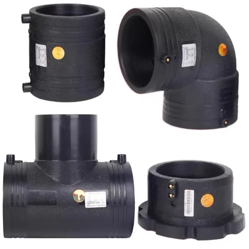 A set of electrofusion fittings — coupler, elbow, tee and reducer — with their terminals and barcode labels visible